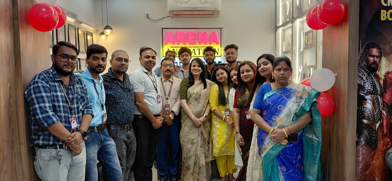 Team photo near Arena Animation signboard